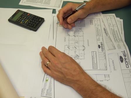 Engineer checking drawings for ahouse