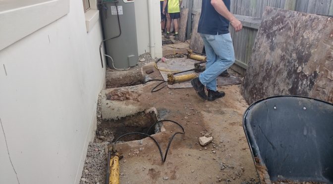 Engineer attending site during house jacking on underpins